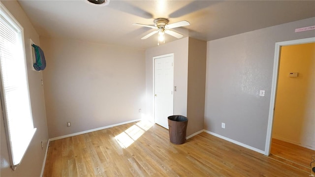 204 W 8th St, Kennett, MO 63857 - empty room featuring ceiling fan, light wood-type flooring, and baseboards