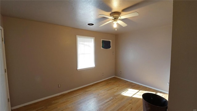 204 W 8th St, Kennett, MO 63857 - empty room featuring baseboards, a ceiling fan, and light wood finished floors