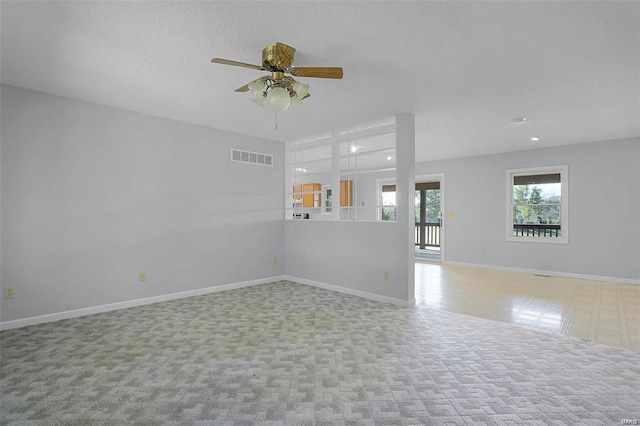 unfurnished living room featuring ceiling fan, baseboards, and carpet floors