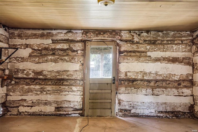 misc room with unfinished concrete flooring