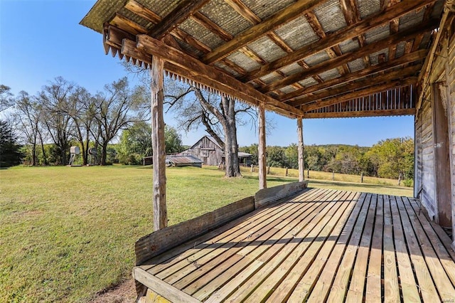 wooden deck with a lawn