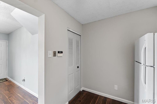 1436 Peacock Ln, Saint Louis, MO 63144 - hallway with a textured ceiling, wood finished floors, and baseboards