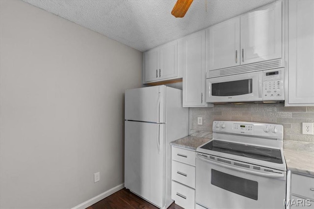1436 Peacock Ln, Saint Louis, MO 63144 - kitchen featuring white appliances, white cabinets, a textured ceiling, decorative backsplash, and ceiling fan