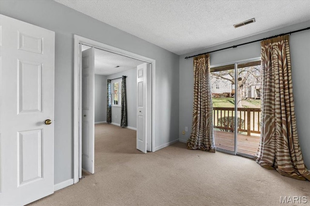 1436 Peacock Ln, Saint Louis, MO 63144 - empty room with carpet flooring, a textured ceiling, and baseboards
