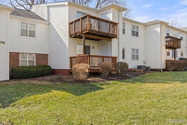 1436 Peacock Ln, Saint Louis, MO 63144 - rear view of property featuring a balcony, a lawn, and central air condition unit