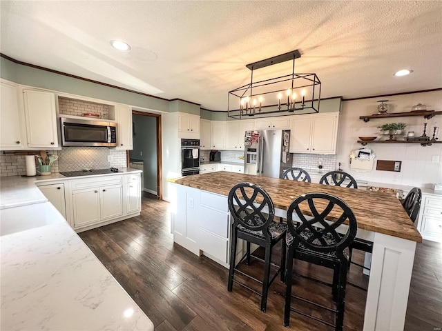 kitchen with stainless steel appliances, open shelves, backsplash, a textured ceiling, and ornamental molding