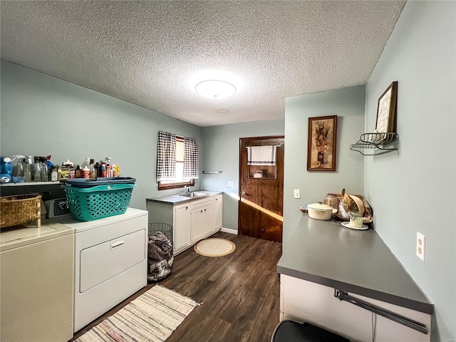 laundry area with independent washer and dryer, cabinet space, dark wood-style floors, and a textured ceiling