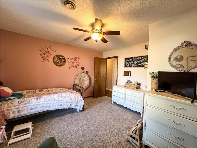 bedroom with carpet, ceiling fan, and a textured ceiling