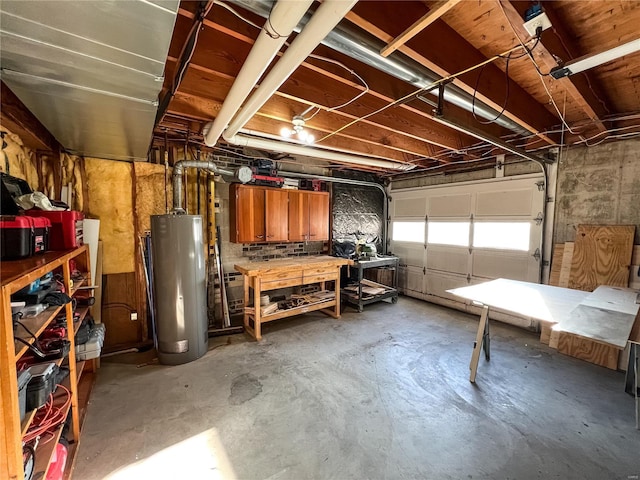 garage featuring water heater and a workshop area