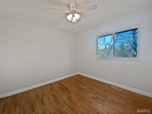 1248 Green Knoll Dr, Fenton, MO 63026 - empty room featuring baseboards, wood finished floors, and a ceiling fan