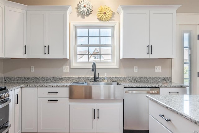 24345 State Route Ww Unit 40/41, Saint Genevieve, MO 63670 - kitchen featuring stainless steel appliances, a sink, white cabinets, and plenty of natural light