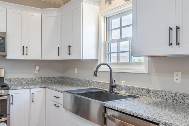 24345 State Route Ww Unit 40/41, Saint Genevieve, MO 63670 - kitchen featuring appliances with stainless steel finishes, white cabinets, and a sink