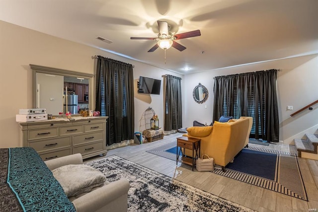 24345 State Route Ww Unit 40/41, Saint Genevieve, MO 63670 - living area with a ceiling fan, light wood-style flooring, and stairs