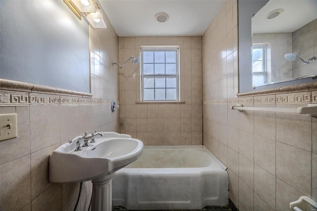 bathroom featuring tile walls and shower / bath combination
