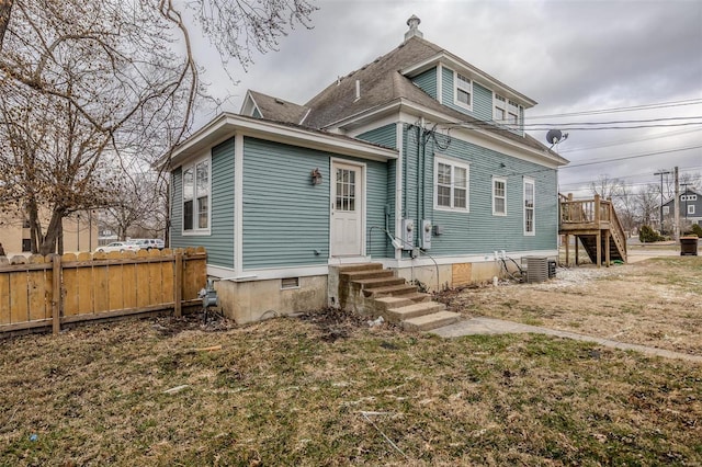 back of house featuring entry steps, stairs, central AC, and a wooden deck