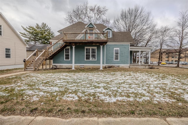 view of front of property with stairs, a wooden deck, and a porch