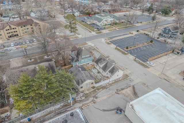 aerial view of property and surrounding area with nearby suburban area