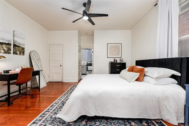4271 Botanical Ave, Saint Louis, MO 63110 - bedroom featuring wood finished floors, a desk, and ceiling fan