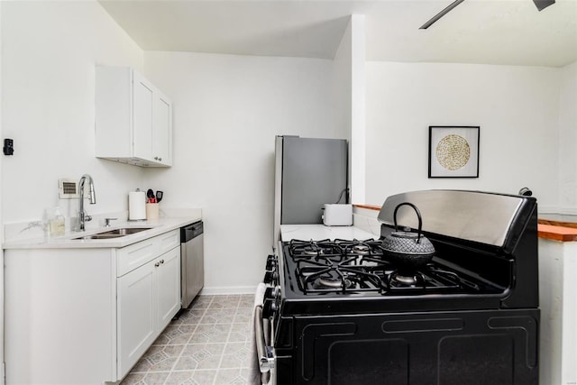 4271 Botanical Ave, Saint Louis, MO 63110 - kitchen featuring black gas stove, a sink, stainless steel dishwasher, and white cabinetry
