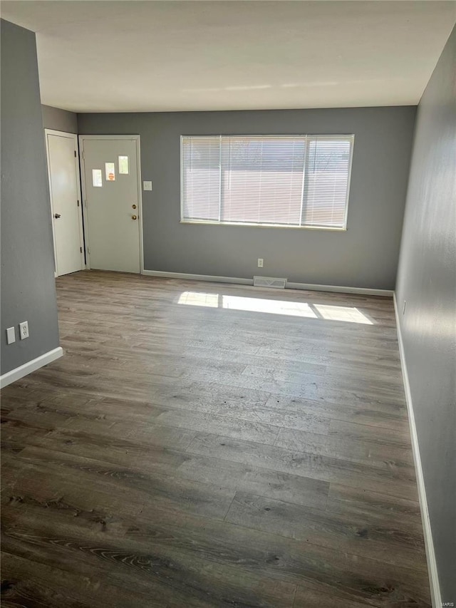 1385 Heydt Ave, Saint Louis, MO 63135 - entrance foyer featuring baseboards and dark wood-style floors