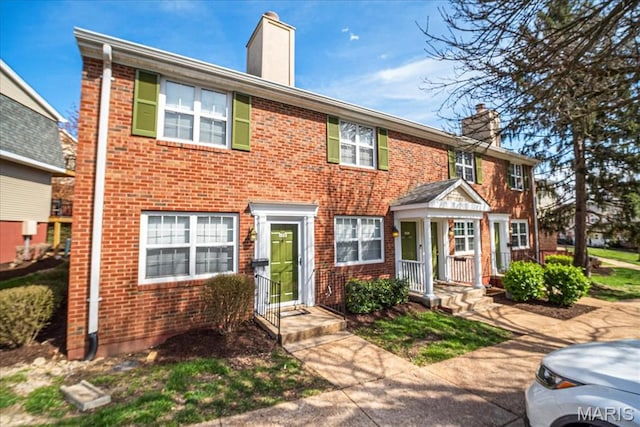 1528 Thrush Ter, Brentwood, MO 63144 - view of property featuring a chimney and brick siding