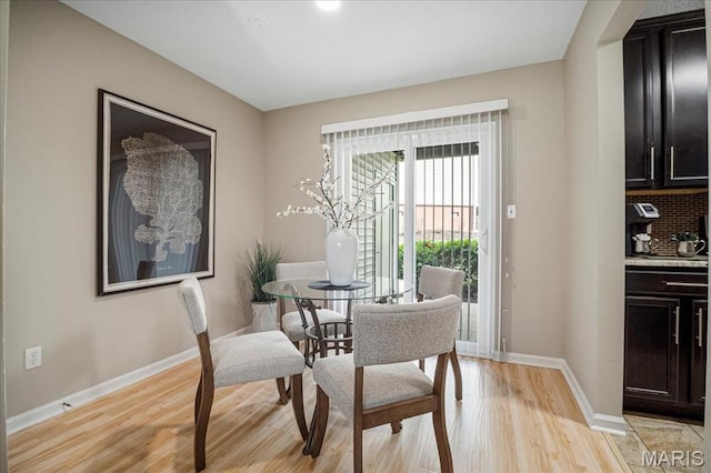 1528 Thrush Ter, Brentwood, MO 63144 - dining space with light wood finished floors and baseboards