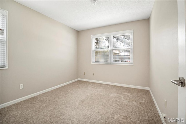 1528 Thrush Ter, Brentwood, MO 63144 - carpeted spare room featuring baseboards and a textured ceiling