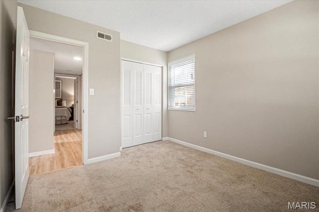1528 Thrush Ter, Brentwood, MO 63144 - unfurnished bedroom with carpet, baseboards, and a closet