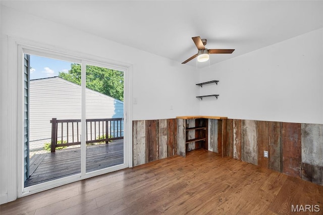 104 Wild Winds Dr, Ofallon, MO 63368 - empty room with wood finished floors and ceiling fan