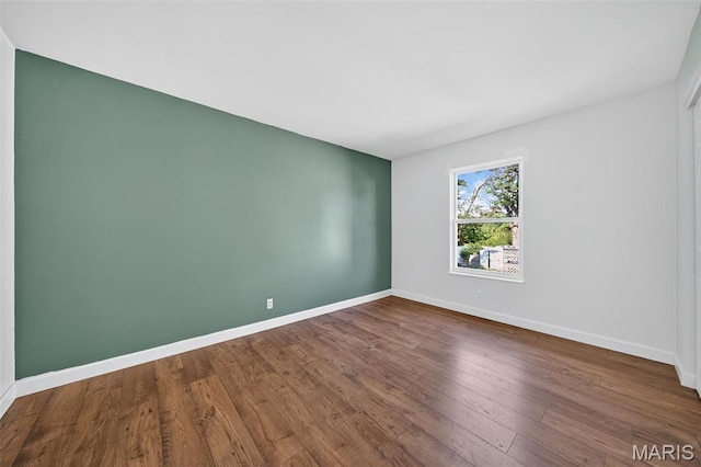 104 Wild Winds Dr, Ofallon, MO 63368 - unfurnished room with baseboards and wood finished floors