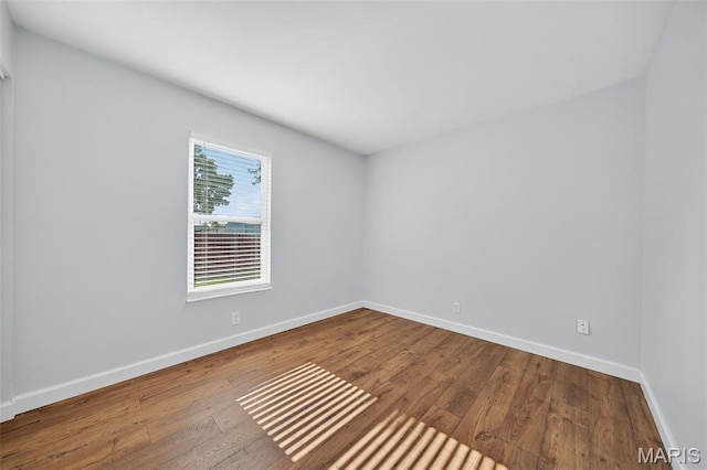 104 Wild Winds Dr, Ofallon, MO 63368 - empty room with hardwood / wood-style floors and baseboards