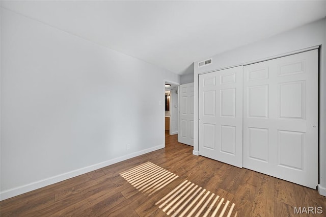 104 Wild Winds Dr, Ofallon, MO 63368 - unfurnished bedroom with wood finished floors and a closet