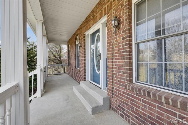 1736 Debra Ln, Arnold, MO 63010 - doorway to property with brick siding and a porch