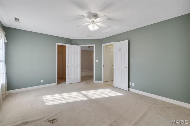 1736 Debra Ln, Arnold, MO 63010 - unfurnished bedroom featuring carpet, baseboards, a spacious closet, and a ceiling fan