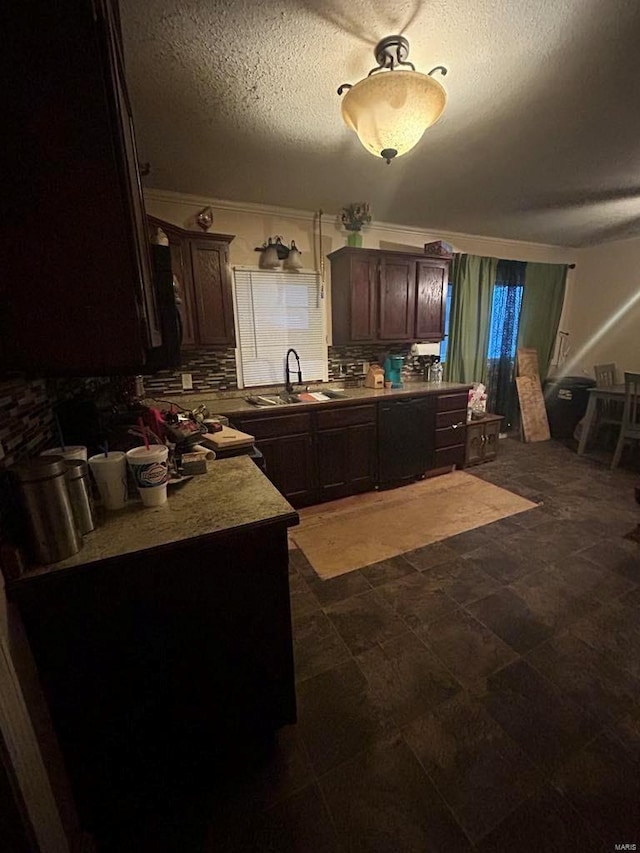 kitchen with a sink, decorative backsplash, dark brown cabinetry, and a textured ceiling