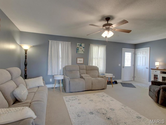 14160 Turkey Run Ct, New London, MO 63459 - living room featuring carpet floors, a ceiling fan, and baseboards