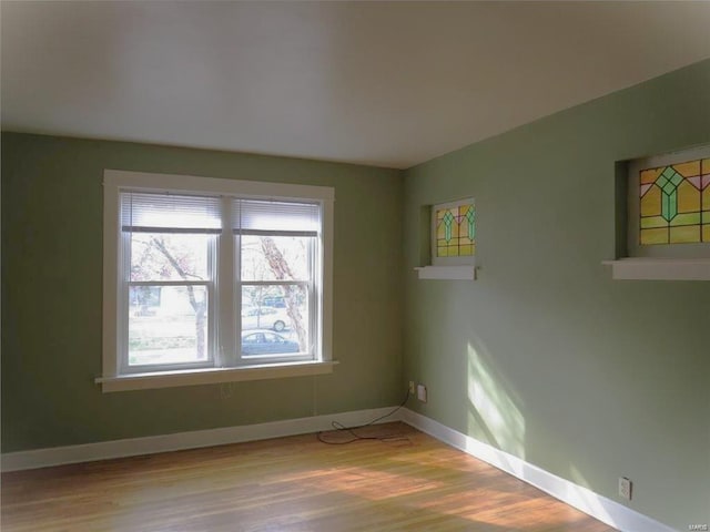 2039 Maury Ave, Saint Louis, MO 63110 - unfurnished room featuring baseboards and wood finished floors