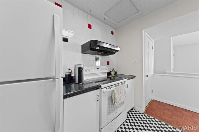 kitchen with white appliances, ventilation hood, dark countertops, tasteful backsplash, and baseboards