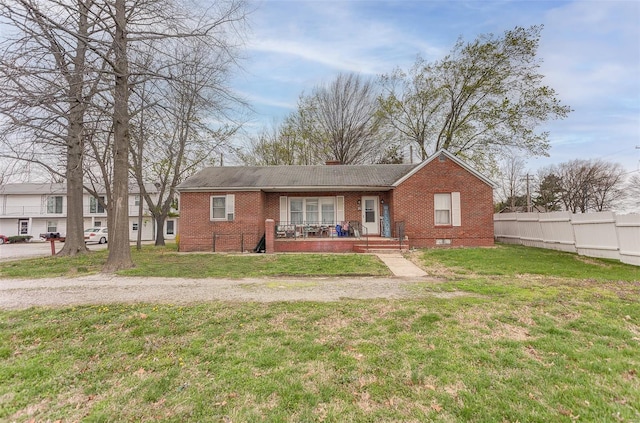1125 N Market St, Sparta, IL 62286 - view of front facade with brick siding, covered porch, and a chimney
