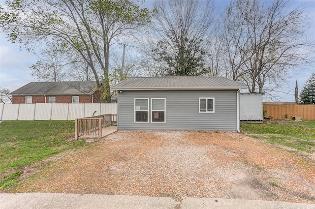 1125 N Market St, Sparta, IL 62286 - back of property featuring fence and metal roof