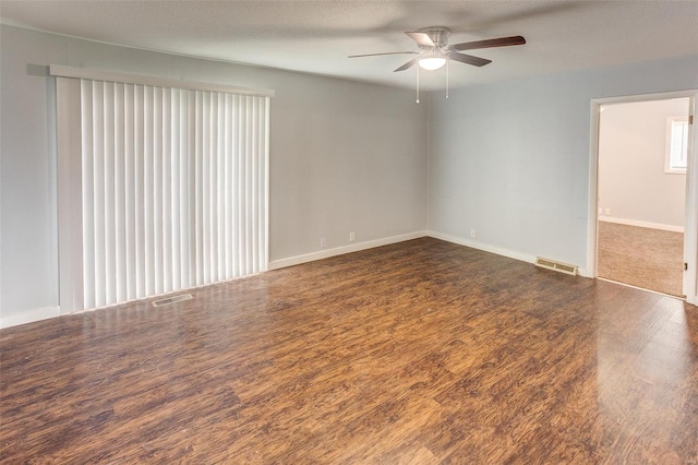 1125 N Market St, Sparta, IL 62286 - spare room featuring ceiling fan, wood finished floors, and baseboards
