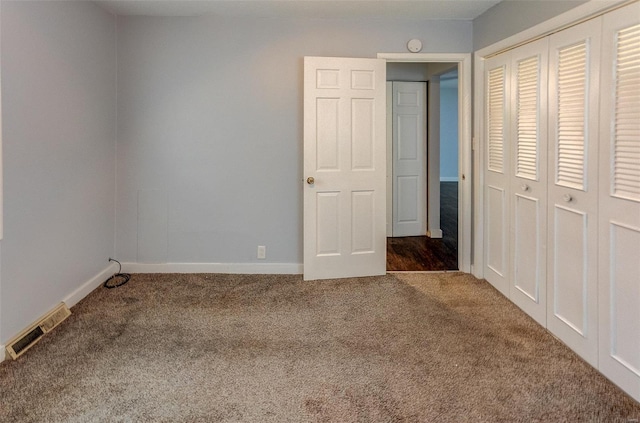 1125 N Market St, Sparta, IL 62286 - unfurnished bedroom with carpet floors, a closet, and baseboards