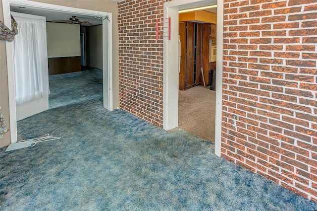 1125 N Market St, Sparta, IL 62286 - spare room with carpet floors and brick wall