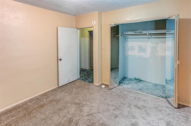 1125 N Market St, Sparta, IL 62286 - unfurnished bedroom featuring carpet, a closet, and baseboards