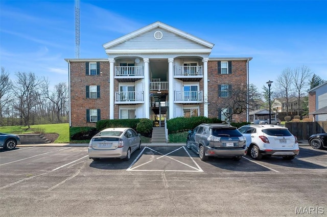 7410 Triwoods Drive E, Saint Louis, MO 63119 - view of property featuring stairs and uncovered parking