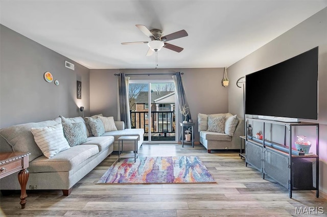7410 Triwoods Drive E, Saint Louis, MO 63119 - living room with ceiling fan and wood finished floors