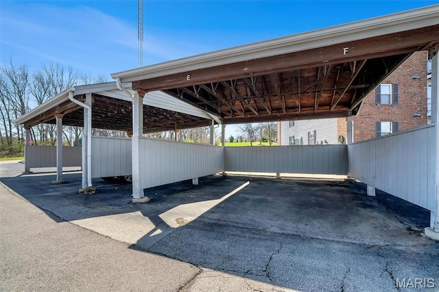 7410 Triwoods Drive E, Saint Louis, MO 63119 - covered parking lot with fence