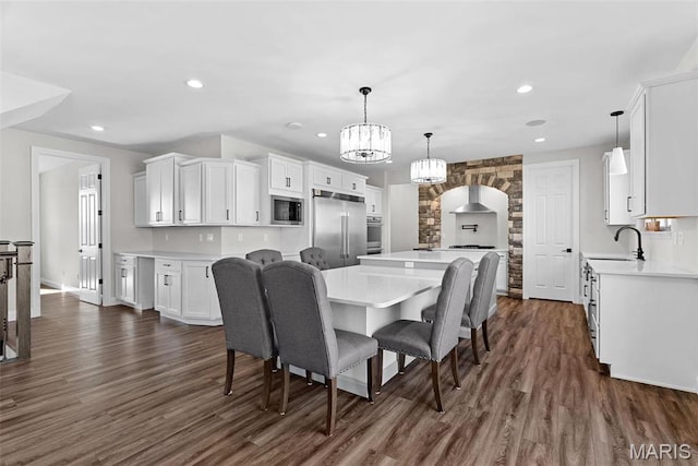 1 Canebrake Ct, Wentzville, MO 63385 - dining room featuring dark wood finished floors, recessed lighting, a chandelier, and baseboards