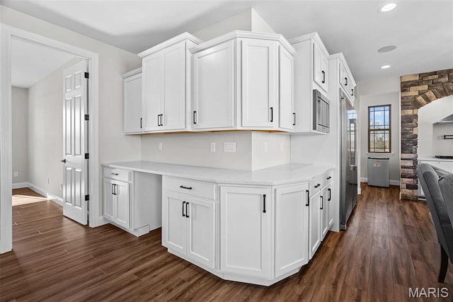 1 Canebrake Ct, Wentzville, MO 63385 - kitchen with light countertops, white cabinets, built in fridge, dark wood finished floors, and recessed lighting