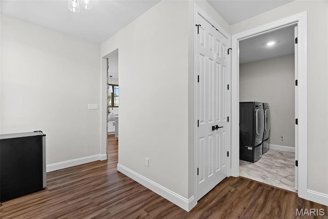 1 Canebrake Ct, Wentzville, MO 63385 - hallway featuring independent washer and dryer, wood finished floors, and baseboards